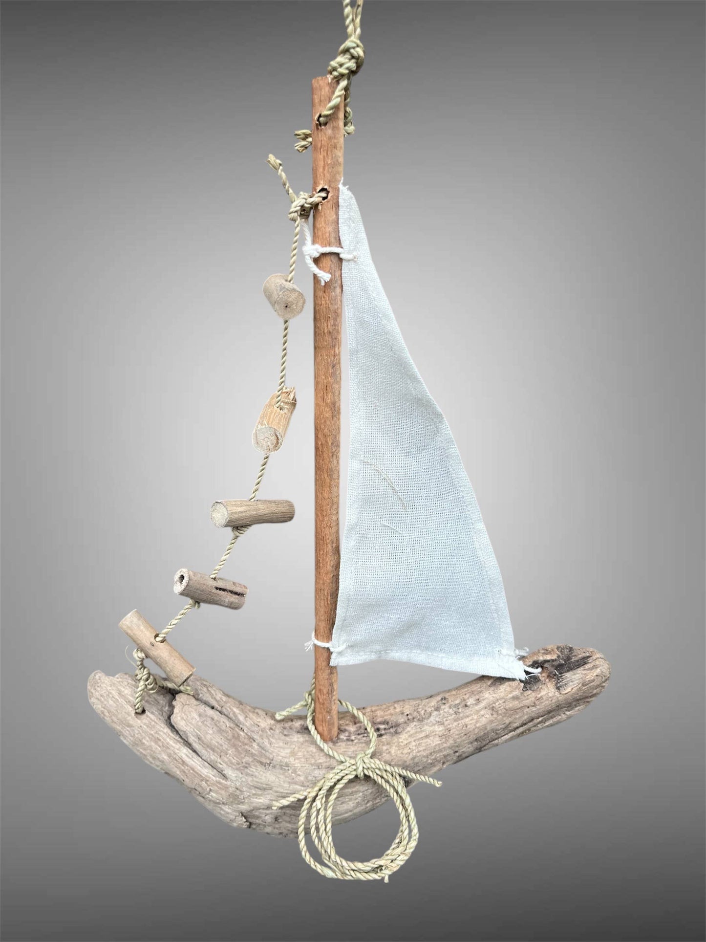 Hanging driftwood boat mobile.