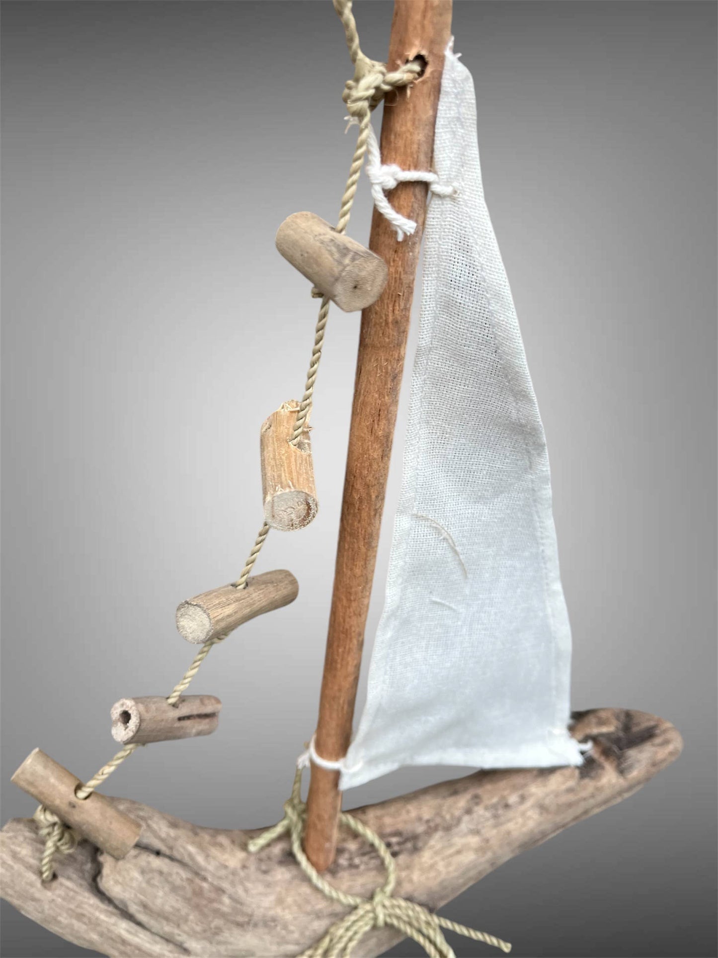 Hanging driftwood boat mobile.
