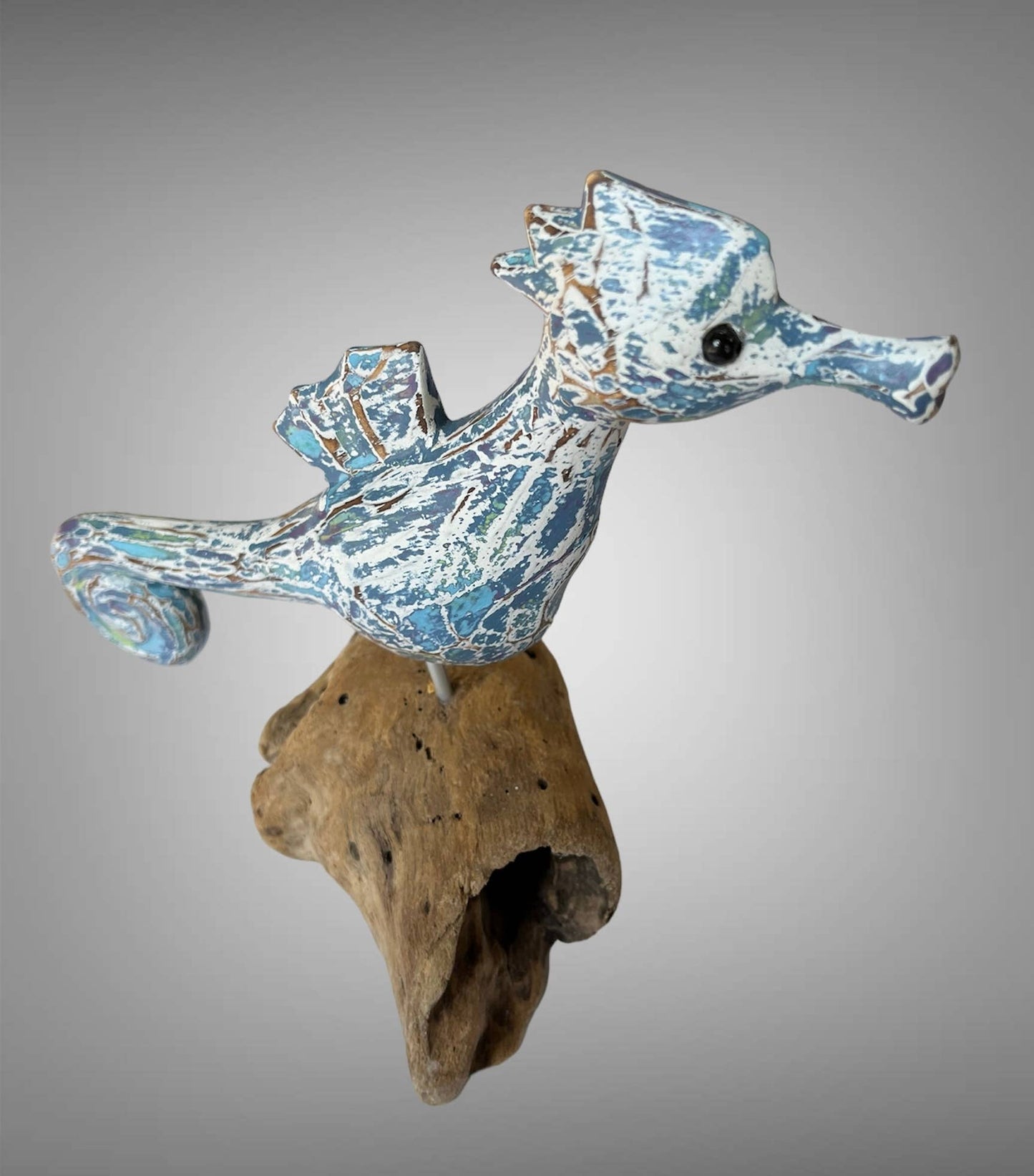 Wooden carved painted seahorse on driftwood wood base